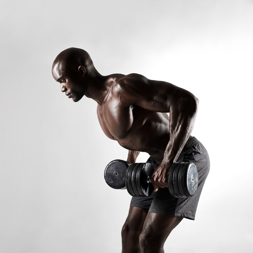 african-bodybuilder-exercising-with-dumbbells-PYYBBGT